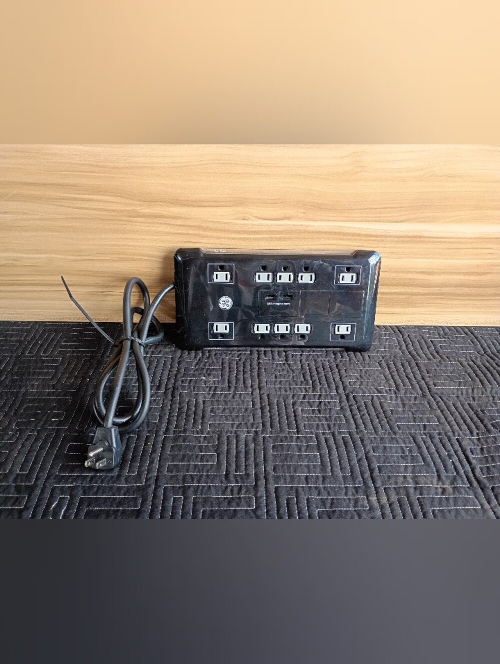 GE UltraPro 12-Outlet Surge Protector with a desktop USB charging dock